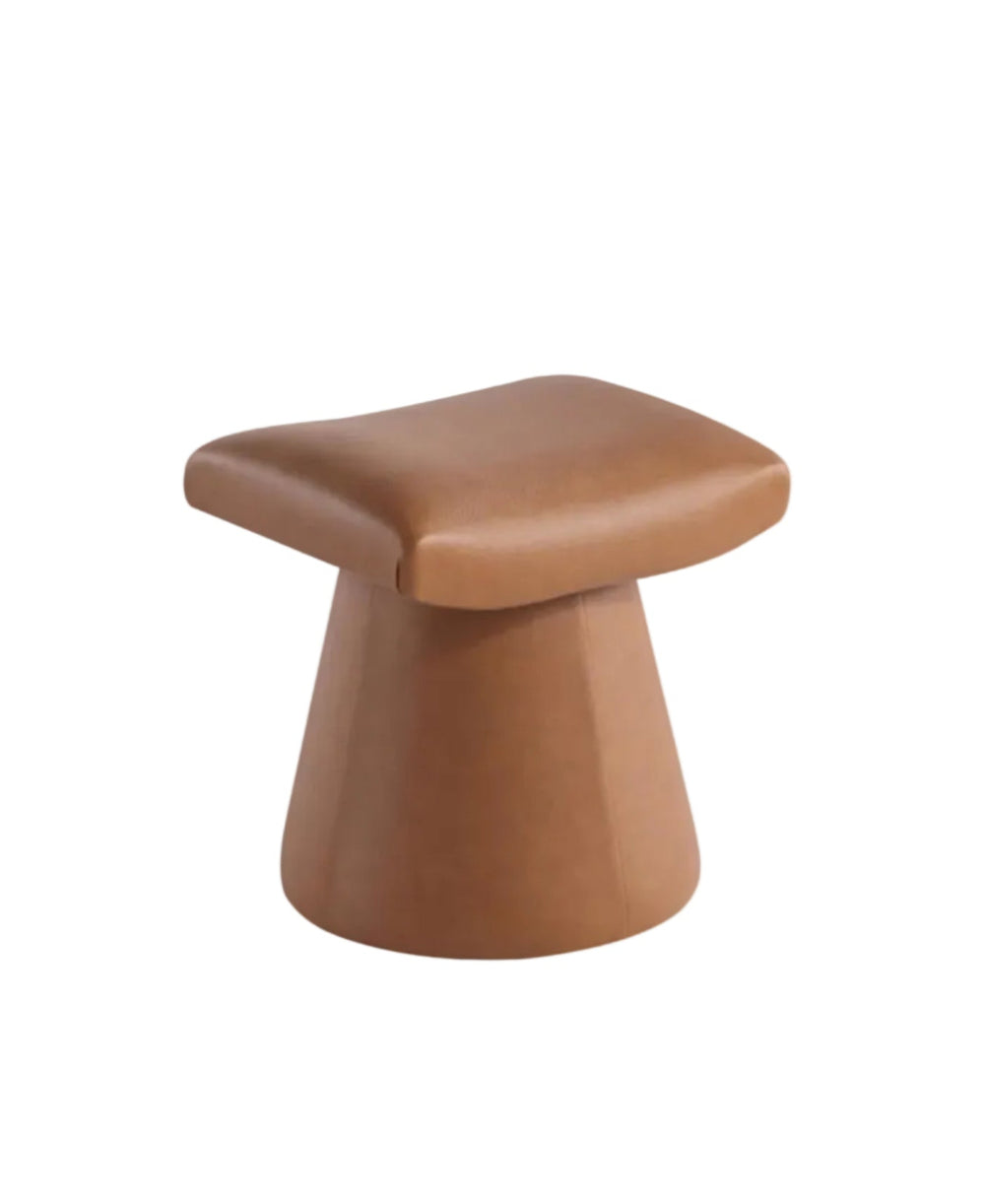 Archer Pro Saddle Ottoman in saddle tan faux leather with a unique curved U-shaped design.