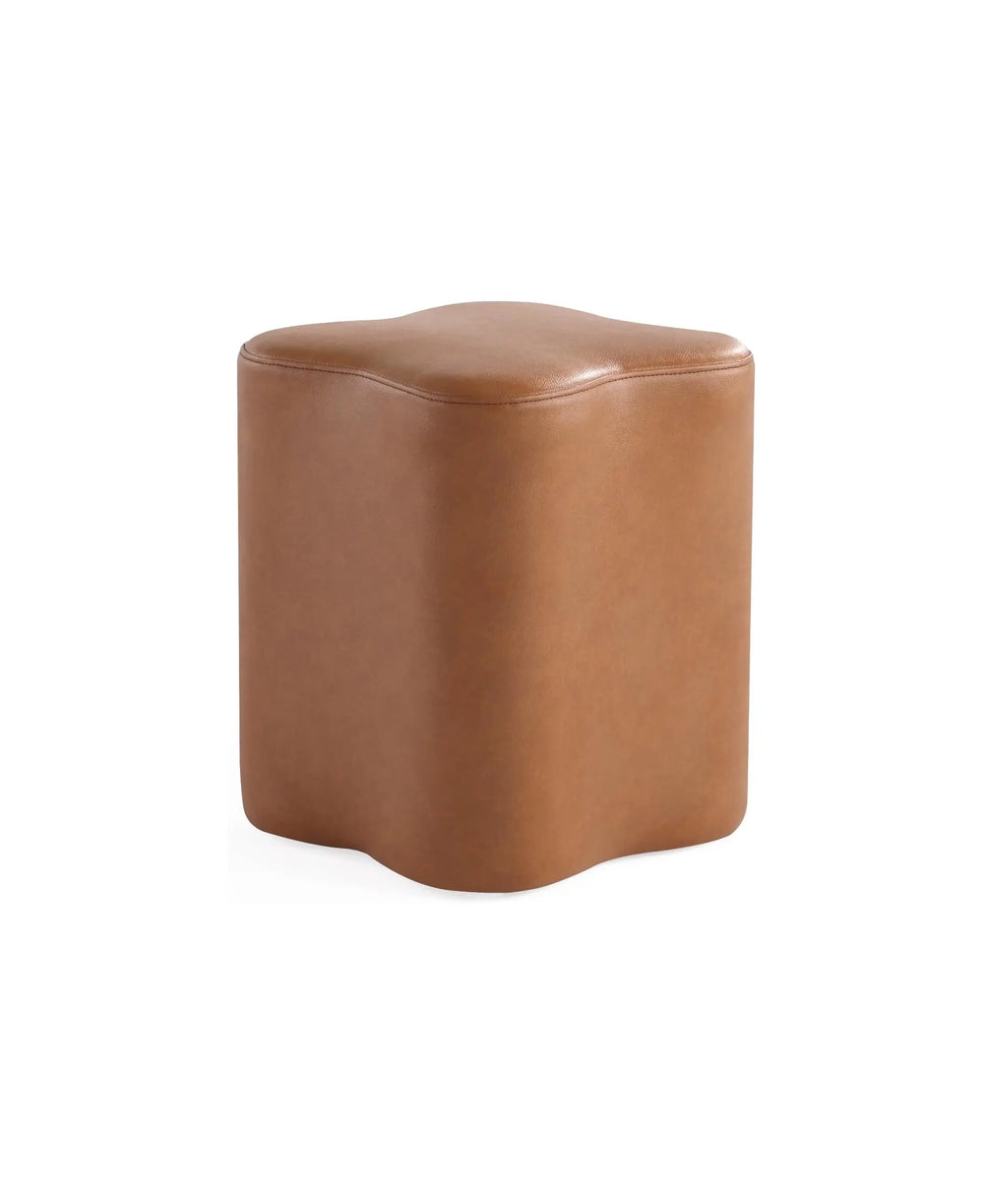 Clover Leather Ottoman with a six-petal flower silhouette in smooth, premium saddle-tan faux leather.