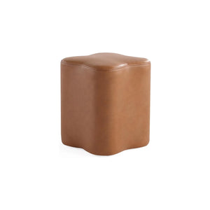 Clover Leather Ottoman with a six-petal flower silhouette in smooth, premium saddle-tan faux leather.