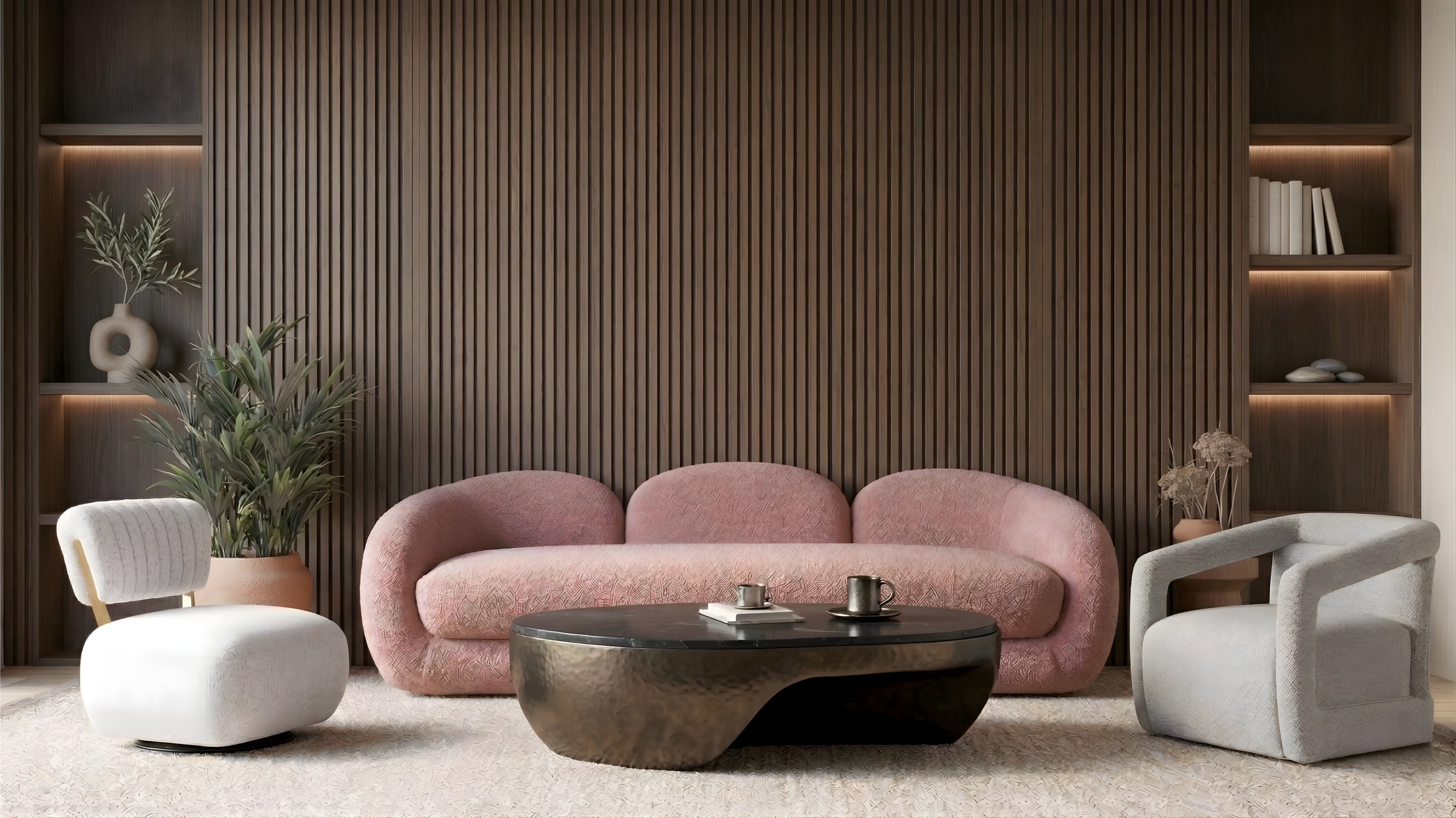 Modern living room with a pink sofa, white chairs, and a round coffee table.